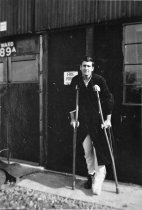 Leon F. Pope on crutches